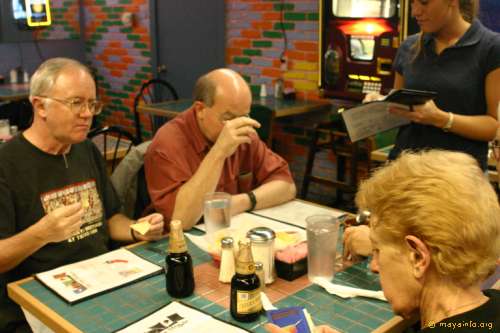 Al Meador, Kerry Berry, and Bea Koch trying to decide what particular Tex-Mex dish is the best. It's hard to decide.