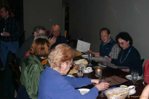 We eat a lot. Bill Renner, Lloyd Anderson, Kathryn Josserand, with Bea Koch in the foreground enjoying Indian food.