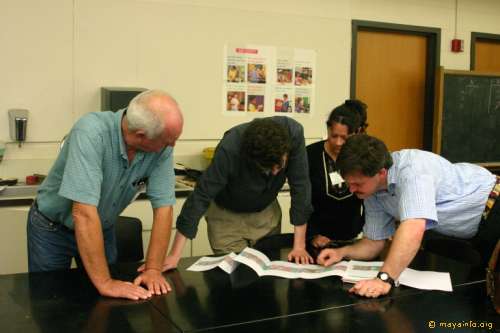 Bruce Love, Simon Martin, Marjorie White Crow, and Nicolai Grube examining the new texts from Chichen Itza.