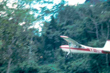 Plane taking off from airstrip at Yaxchilan.