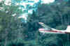 Plane taking off from airstrip at Yaxchilan.