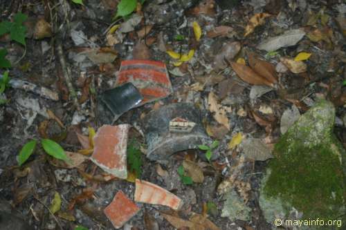 Various polychrome pottery shards from a looters trench.