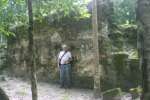 John Mack in front of a structure at Nakbe.
