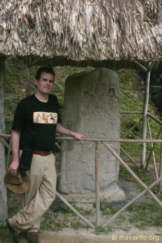 Greg Reddick next to reproduction of Stela 41 at Tikal.